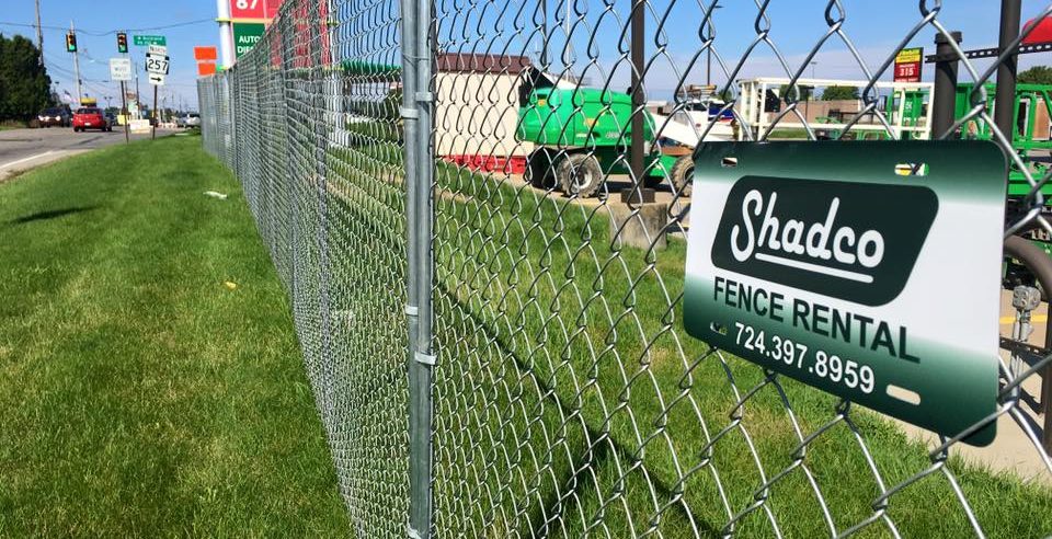 temporary fence panels with a shadco sign attached